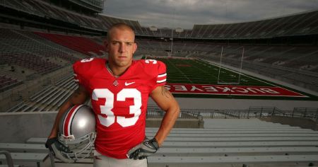 James Laurinaitis poses for a picture in a staduim.
